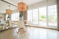 Dining table and chairs leading out on to the terrace.